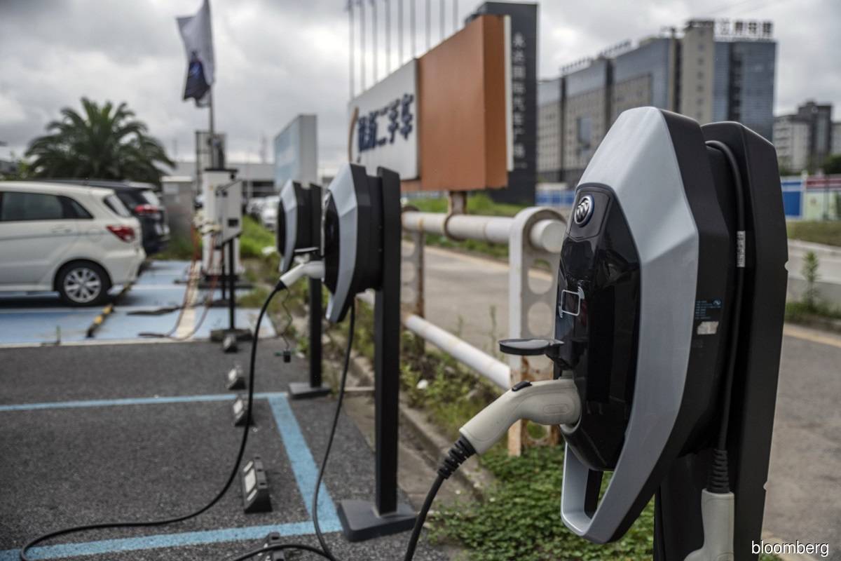 An electric vehicle charging station in China. Rystad’s analysis of existing mines, projects and development plans estimated that global nickel supply will fall short of demand in 2024, with production of 3.2 million tonnes. (Photo by Bloomberg)
